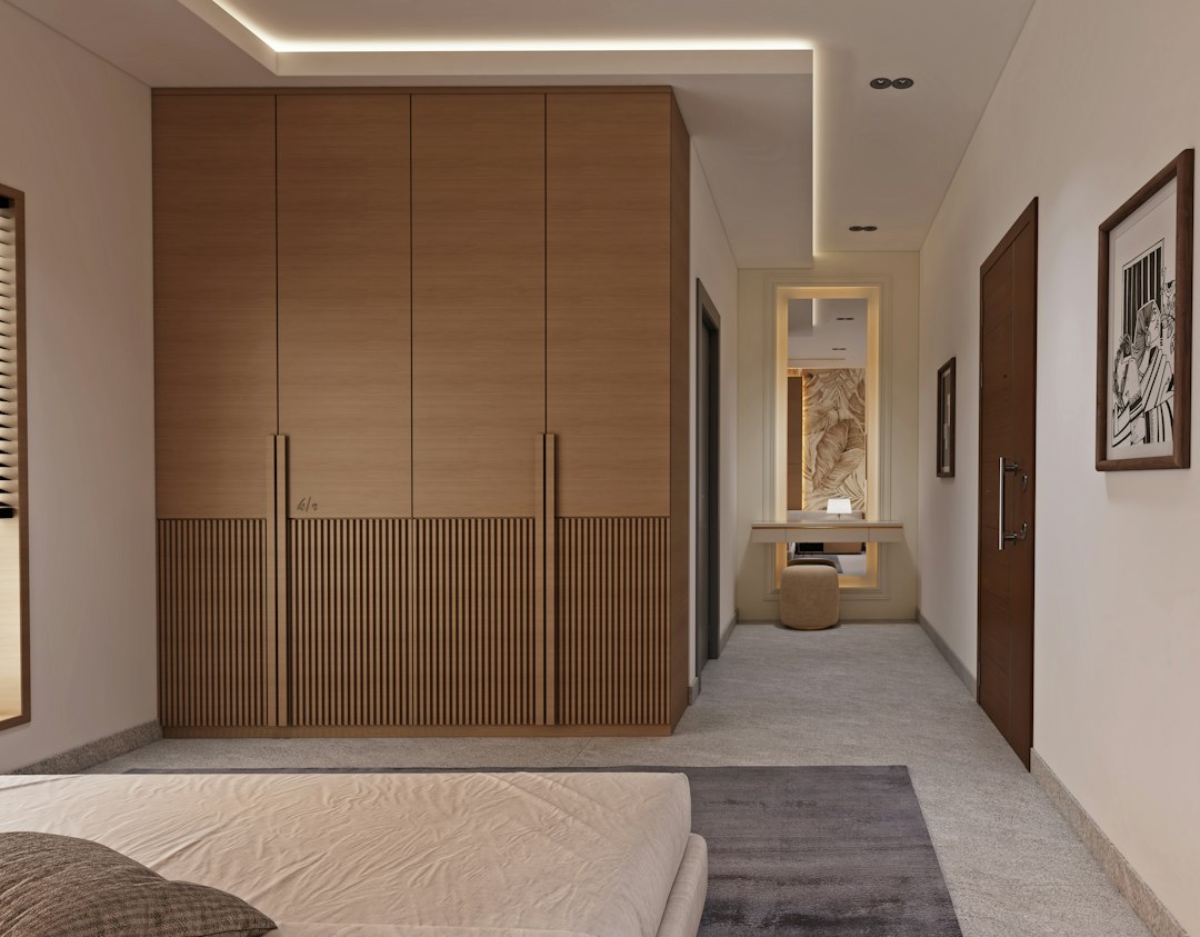Modern hinged wardrobe bedroom interior with warm wood finish and soft lighting