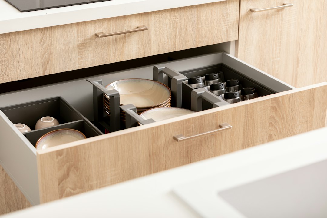 Organized modular kitchen drawer storage with plates and kitchen accessories